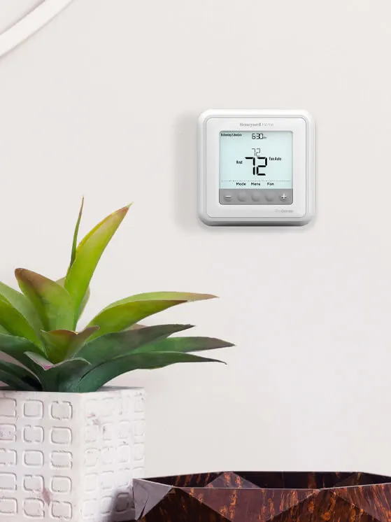 resideo-home-thermostat-on-wall